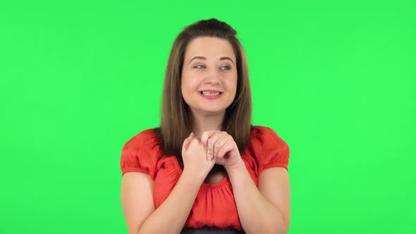 Portrait of Cute Girl Is Waiting in Anticipation with Pleasure. Green Screen
