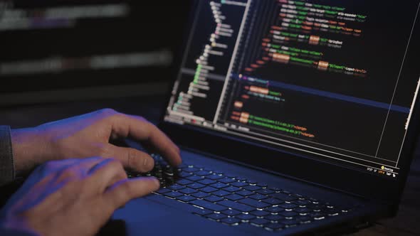 Programmer's Hands and Laptop Keyboard Closeup