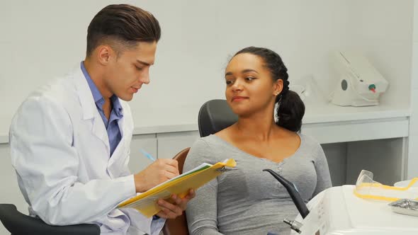 Dentist Filling Medical Papers of His Female Patient 1080p