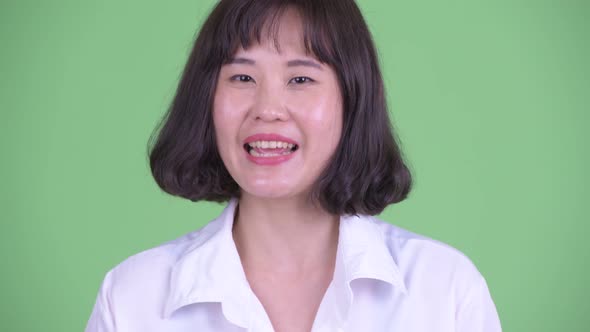 Face of Happy Asian Businesswoman Nodding Head Yes