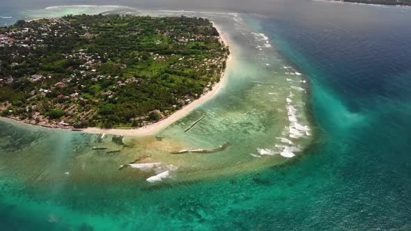 Aerial view of an Island and its surrounding reefs