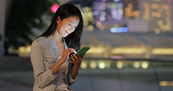 Woman use of cellphone at street