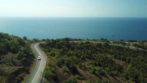 Drones Eye View - Winding Road From the High Mountain Pass To Crimea. Great Road Trip