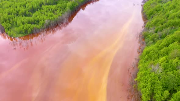 Aerial View of Red Waste Lake Polluted With Metals From a Copper Mine