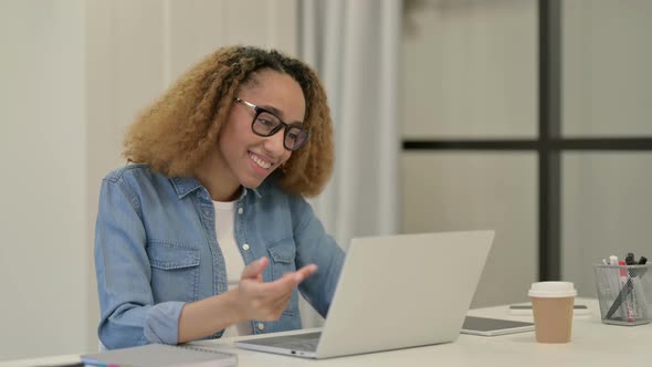 African Woman Talking on Video Call on Laptop