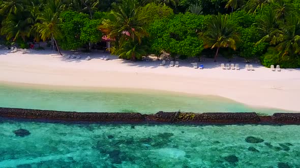 Close up nature of resort beach by blue lagoon with sand background near waves