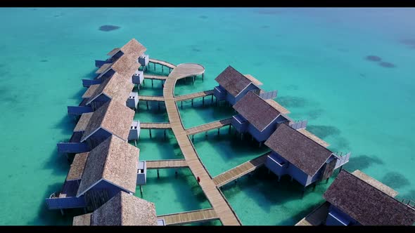 Aerial drone shot travel of beautiful lagoon beach holiday by aqua blue water and clean sandy backgr