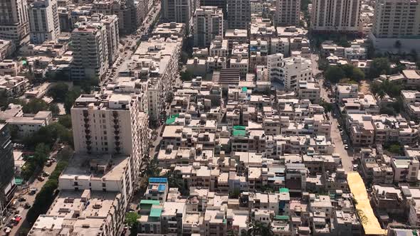 Aerial Flying Over Densely Packed Buildings In Karachi. Dolly Forward