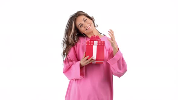 Funny Woman Peeping Into Gift Box Enjoying Desired Present