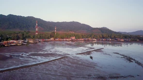 Aerial view of low tide at gypsy village in Old Town, Koh Lanta, Thailand - camera tracking