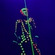 Dancer in Luminous Clothes Mask Turns Green Beam on Stage - VideoHive Item for Sale