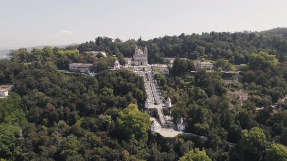 Aerial Orbiting over Christian pilgrimage site, Bom Jesus Mount surrounded By forest - Braga