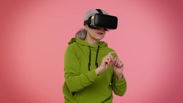 Elderly Stylish Granny Woman Using Headset Helmet App to Play Simulation Virtual Reality VR Game