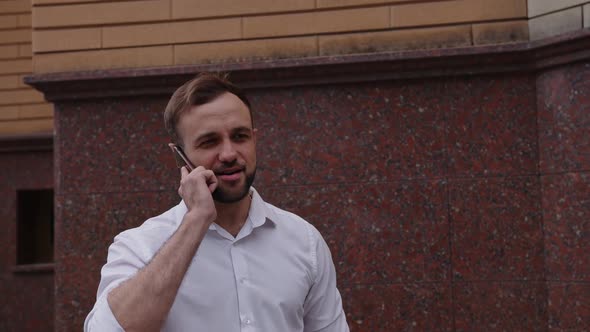 Close Up View of Young Man with His Phone