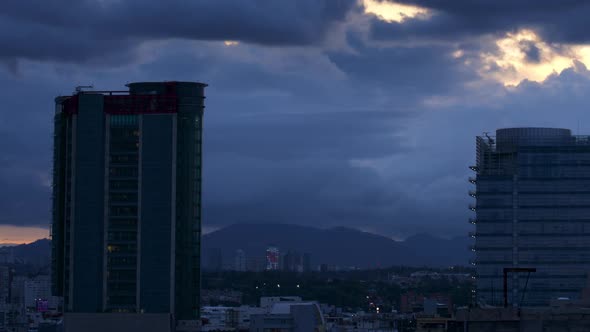 Panning Timelapse of Clouds Moving as Evening Sets in City