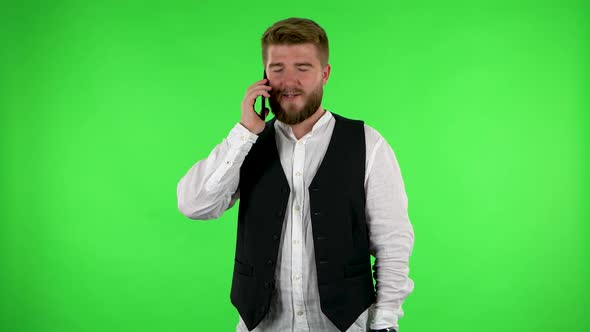 Man Talking for Mobile Phone and Rejoice. Green Screen