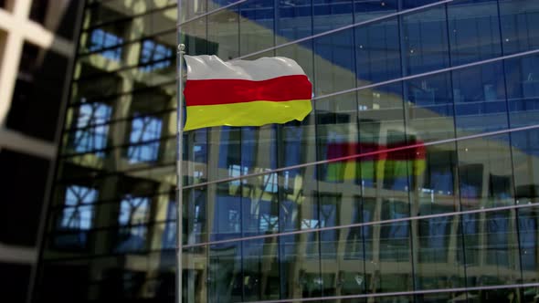 South Ossetia Flag Waving On A Skyscraper Building