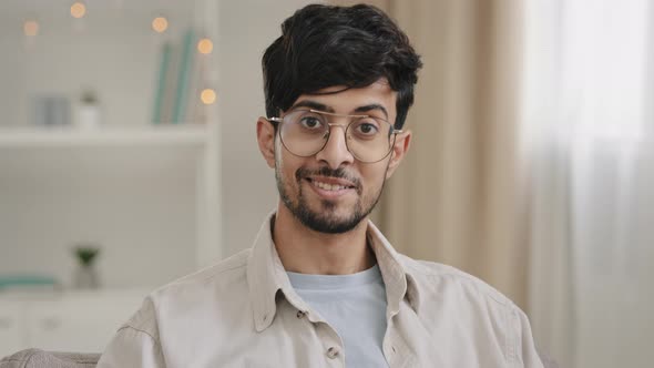 Male Portrait Closeup Bearded Face Millennial Arabic Indian Man Guy with Glasses Looking at Camera