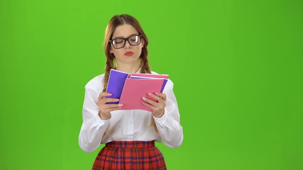 Student Flips Through the Notebook . Green Screen