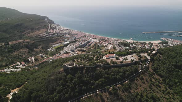 Top down view Sesimbra Natural coastline and Castle on hilltop, mesmerizing Landscape - Portugal