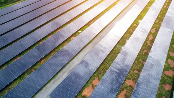 Drone fly over solar farm, renewable energy from solar.