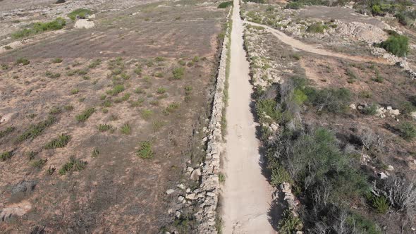 Aerial drone video from northern Malta near the Ghajn Znuber Tower.