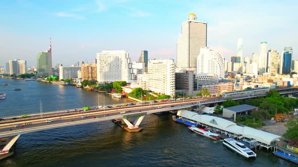 4K : Drones fly over the Chao Phraya River, buildings and business districts in Bangkok