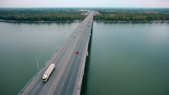 Beautiful View of the Bridge Over the River, Passing Cars Through the Bridge, Aerial