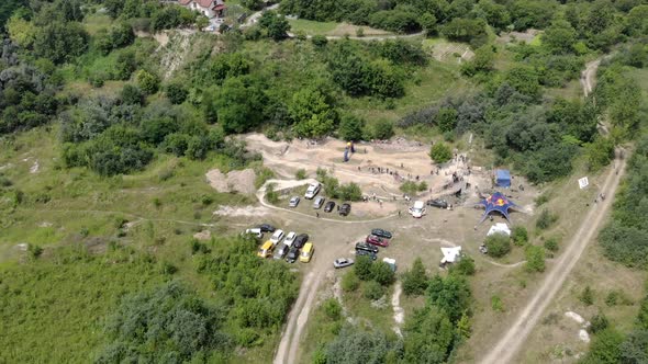 AERIAL Bicycle Pumping Competitions. Competitive Athletic Young Bmx Rider Carving Berms and Pumping