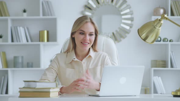 Smiling young girl communicating by video live, microphone and webcam