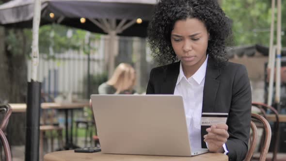 Online Shopping Failure for Young Woman Sitting on Bench