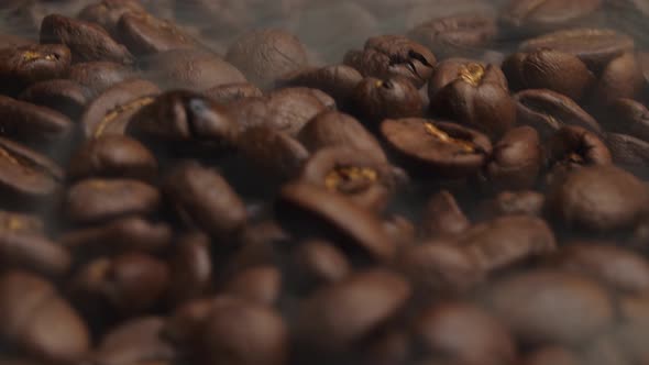 Close Up Of Coffee Beans Fresh Roast With Smoke