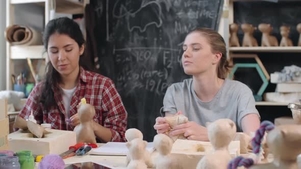 Women Making Toys with Craft Paper