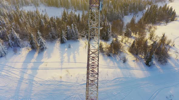 Flying Over Radio Communications Tower Mountain Snow Covered Winter Landscape