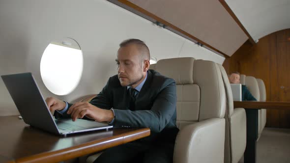 Successful Business Man Traveling on His Private Jet