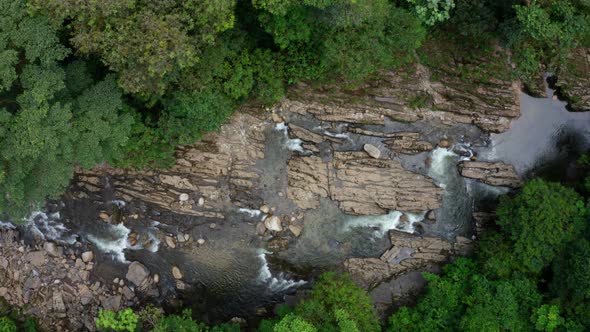 Still video of a tropical stream running in the tropical forest between rocks