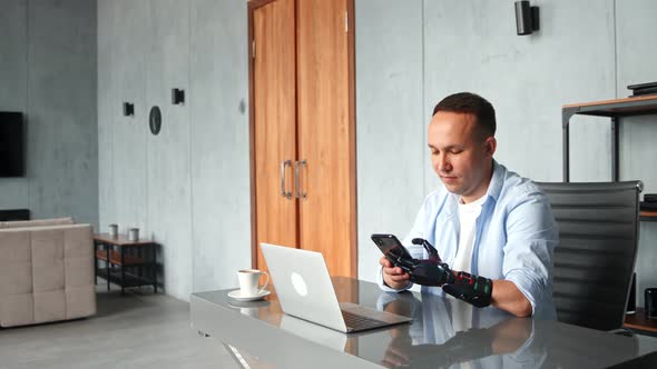 Concentrated man hacker with black bio hand prothesis types on smartphone