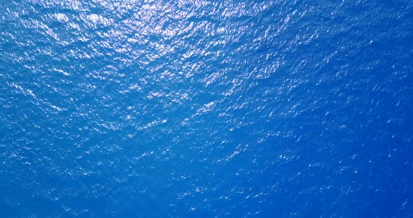 Beautiful aerial abstract shot of a paradise sunny white sand beach and aqua blue water background i