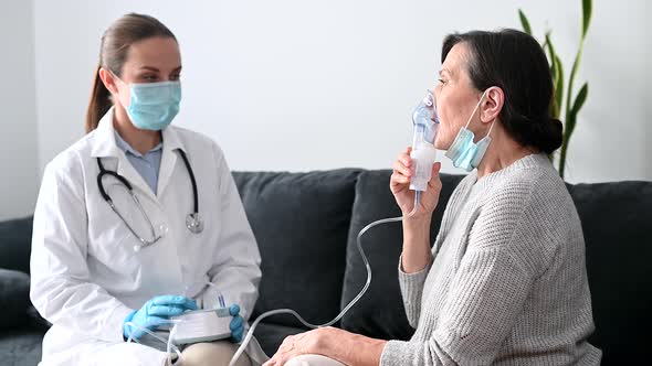 A Female Doctor Nurse Wearing a Medical Gown and a Face Mask