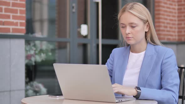 Young Businesswoman working on Laptop, Outdoor