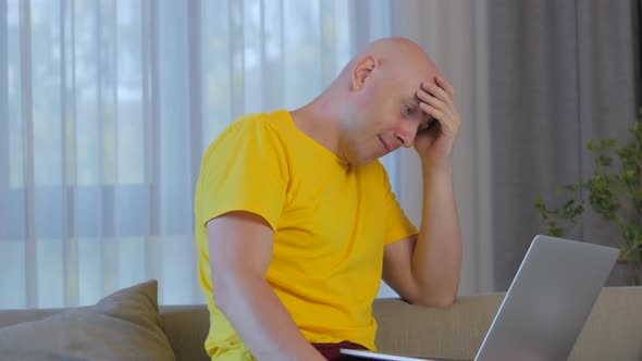 Concerned Caucasian Freelancer Man Working on a Laptop,tired,solving Problems at Work,serious Man