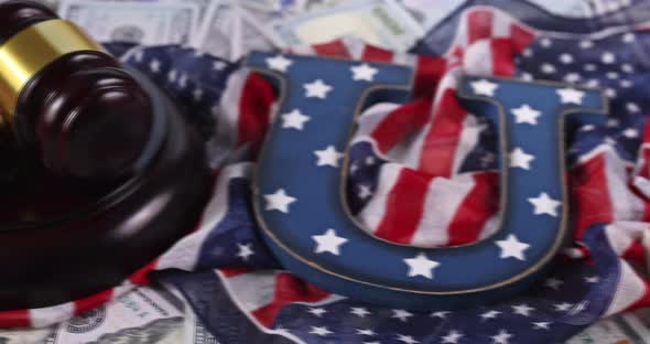 Hundred dollars of the American flag with judge s gavel corruption concept