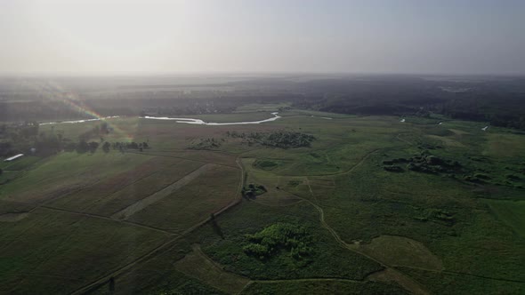 River and Green Fields in Countryside