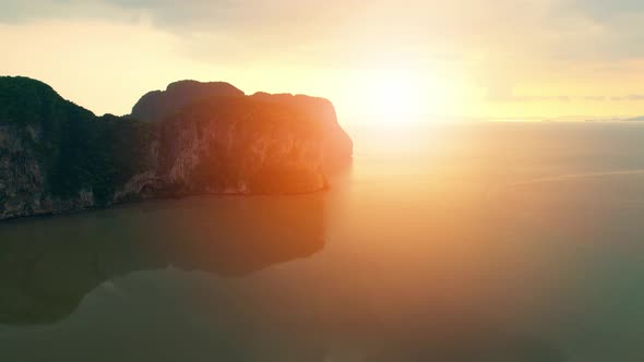 Aerial view over the coast, mountains and beaches during beautiful sunsets