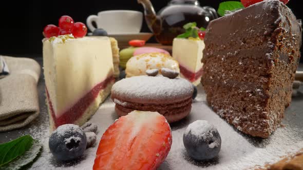 Variety of Cakes with Fruits. Cheese Cake, Chocolate Cake and Cream Puff Cake. Strawberry and Mint