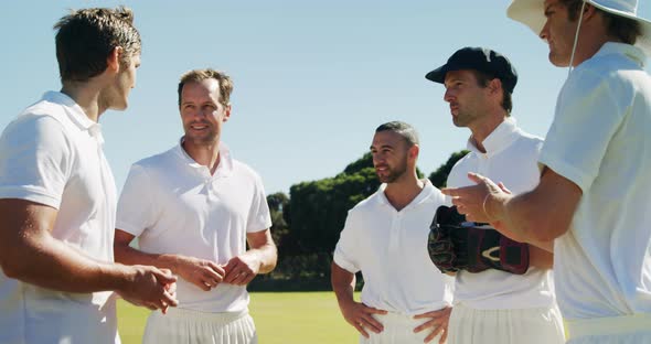 Cricket players into team discussion during cricket match