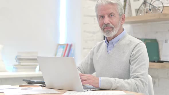 Admiring Old Man Shaking Head To Allow