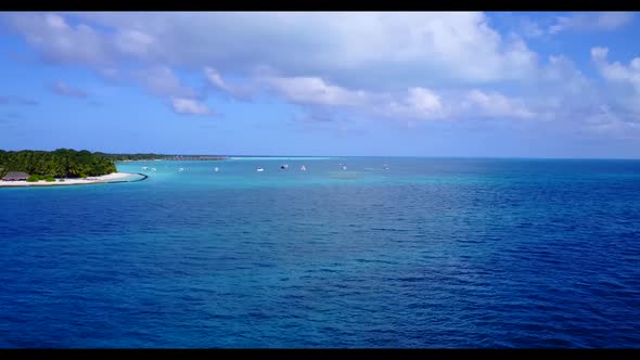 Aerial flying over seascape of beautiful resort beach holiday by blue water and white sandy backgrou