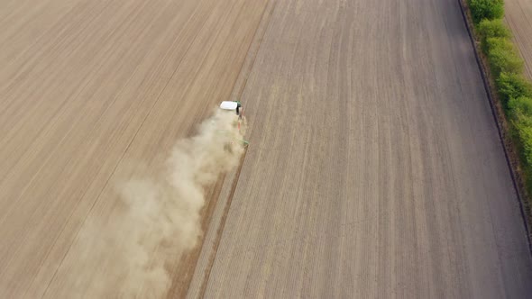 Aerial view of an agriculture field with tractor