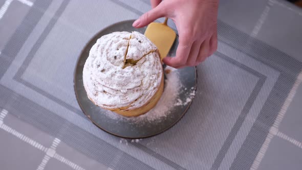 Woman Taking Piece of Traditional Easter Cruffin Cake  Happy Easter Concept